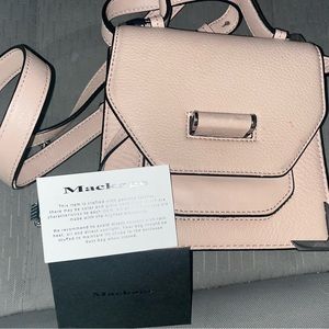 Like new barley used purse with hand strap or shoulder strap.